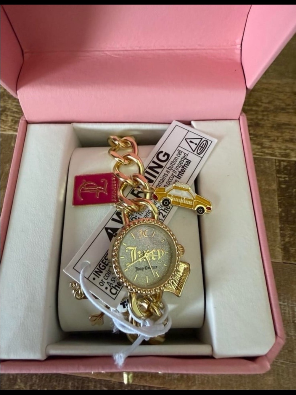 Juicy Couture Gold Charm Bracelet Watch with Pink Tag and Yellow Taxi Charm
